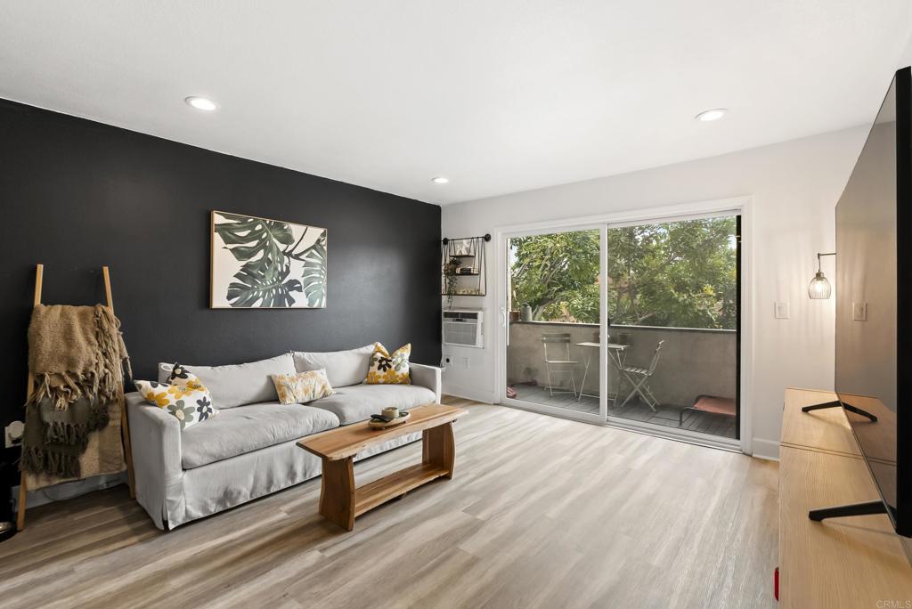 6780 Friars Road, Unit 243 San Diego, CA 92108 - Photo 14 of 31 a living room with furniture and a flat screen tv