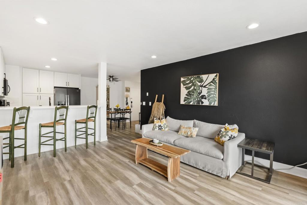 6780 Friars Road, Unit 243 San Diego, CA 92108 - Photo 15 of 31 a living room with furniture and a flat screen tv