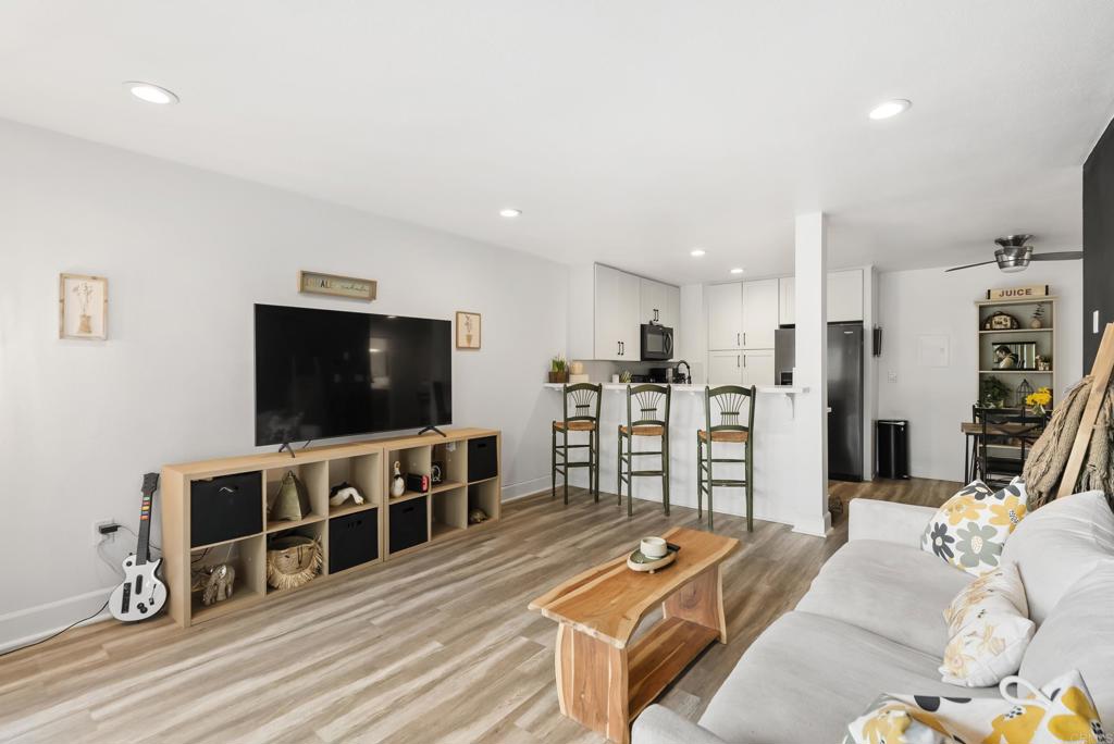 6780 Friars Road, Unit 243 San Diego, CA 92108 - Photo 16 of 31 a living room with furniture and a flat screen tv