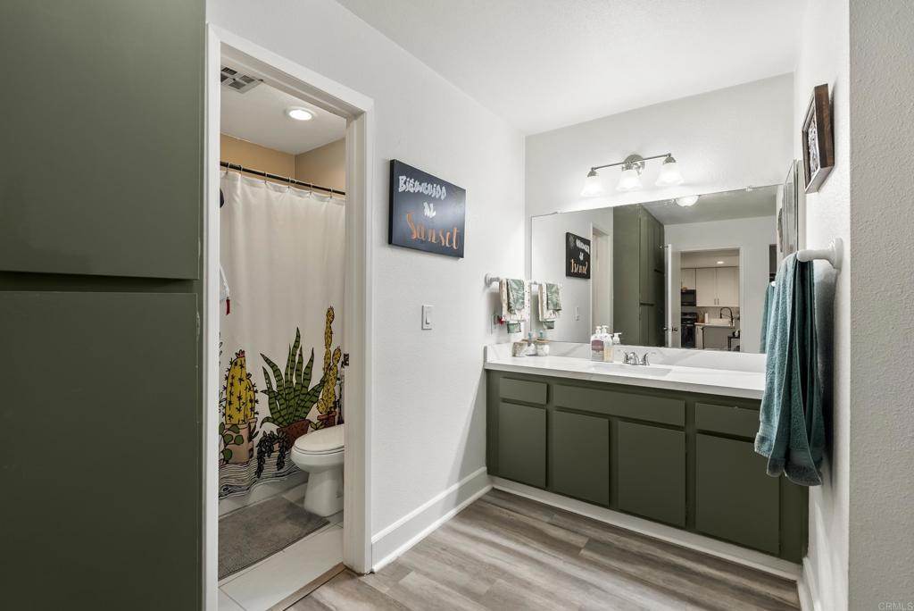 6780 Friars Road, Unit 243 San Diego, CA 92108 - Photo 22 of 31 a spacious bathroom with a granite countertop sink and a mirror