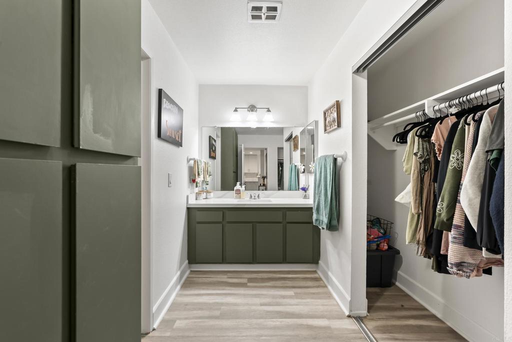 6780 Friars Road, Unit 243 San Diego, CA 92108 - Photo 23 of 31 a bathroom with a sink a mirror and a shower
