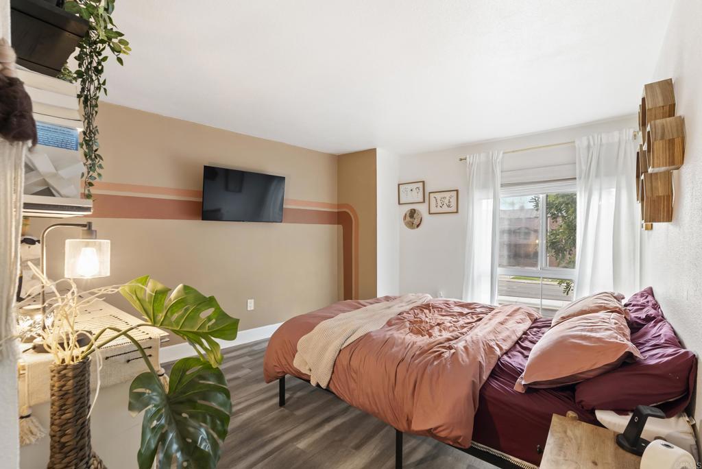 6780 Friars Road, Unit 243 San Diego, CA 92108 - Photo 26 of 31 a bedroom with a bed and a potted plant