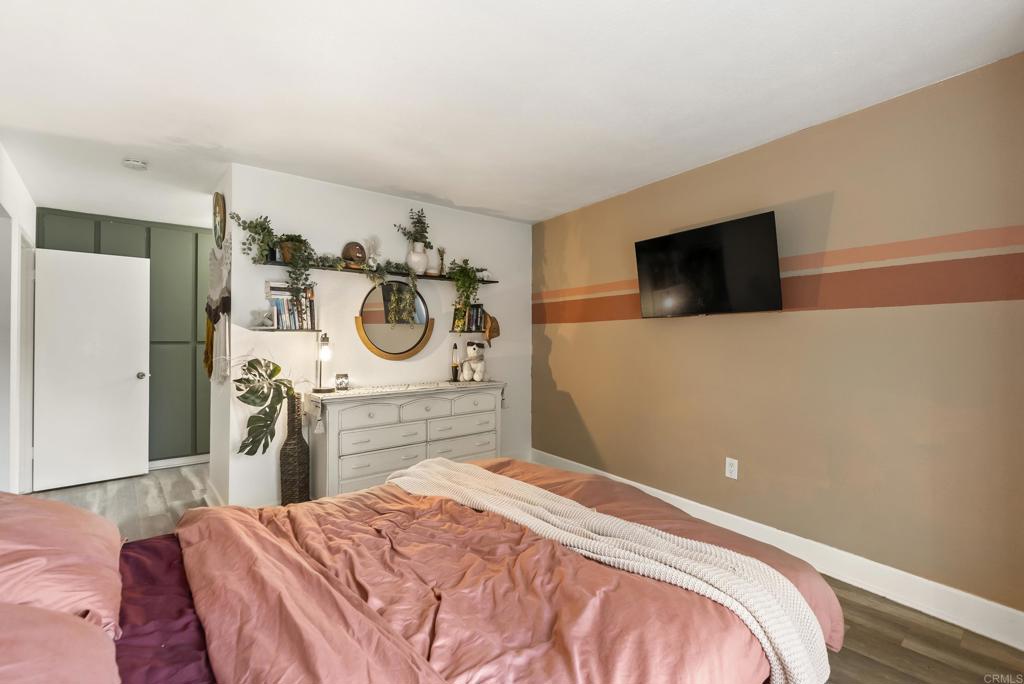 6780 Friars Road, Unit 243 San Diego, CA 92108 - Photo 29 of 31 a bedroom with a bed and a flat screen tv