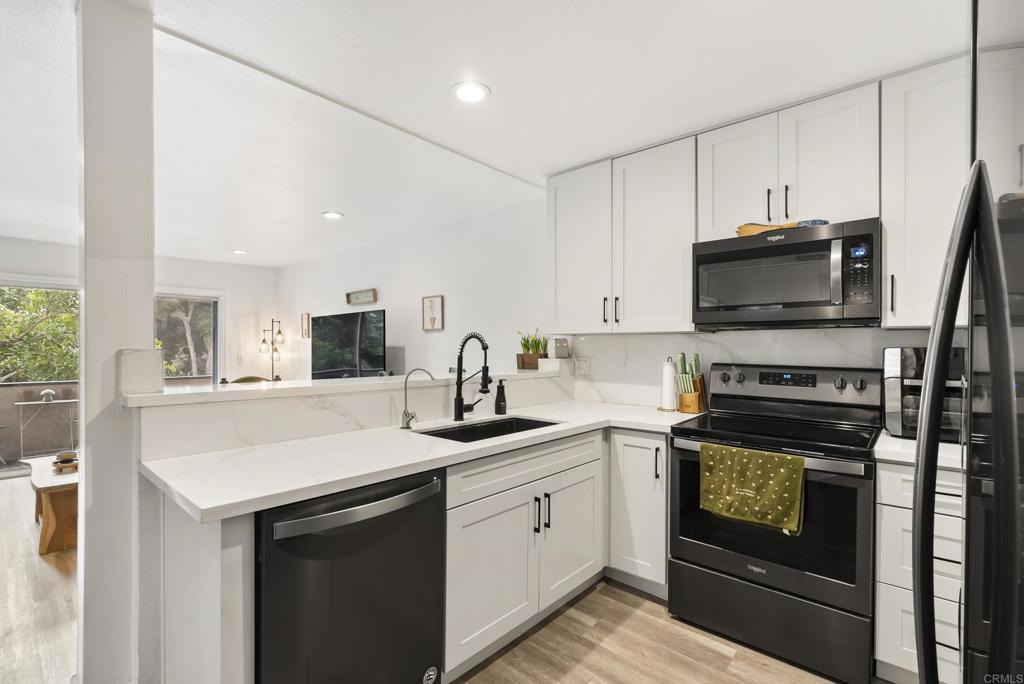 6780 Friars Road, Unit 243 San Diego, CA 92108 - Photo 8 of 31 a kitchen with a sink stove and microwave