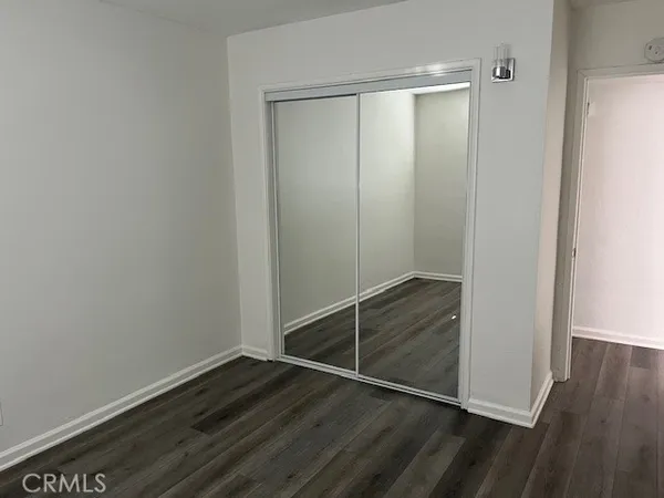 an empty room with wooden floor