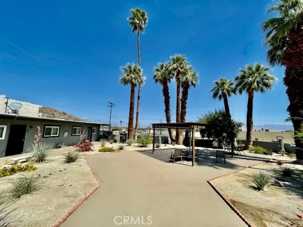 a view of a swimming pool with a bench