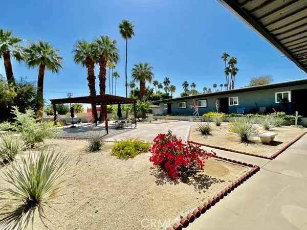 a view of a backyard with a swimming pool