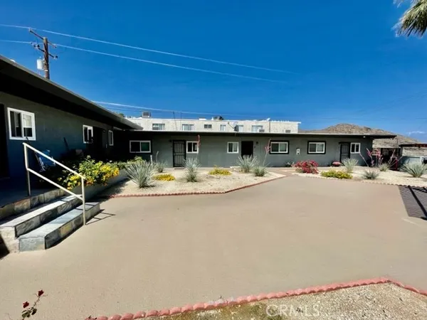 a view of swimming pool with a patio