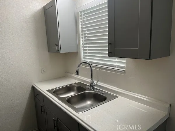 a kitchen with a sink and a window