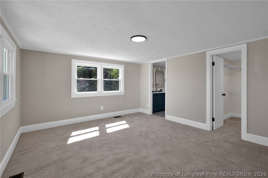 88 Hannah Creek Road Four Oaks, NC 27524 - Photo 13 of 31 an empty room with windows