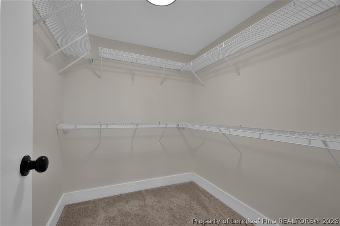 88 Hannah Creek Road Four Oaks, NC 27524 - Photo 18 of 31 a view of a room with racks on the wall