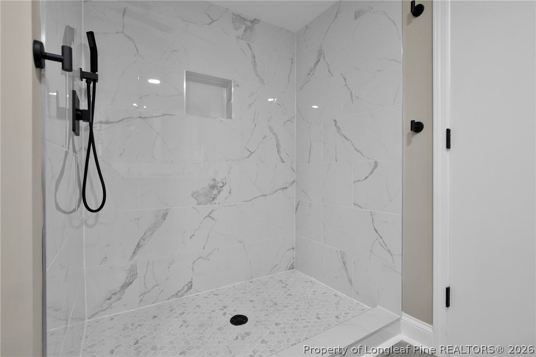 88 Hannah Creek Road Four Oaks, NC 27524 - Photo 20 of 31 a bathroom with a shower