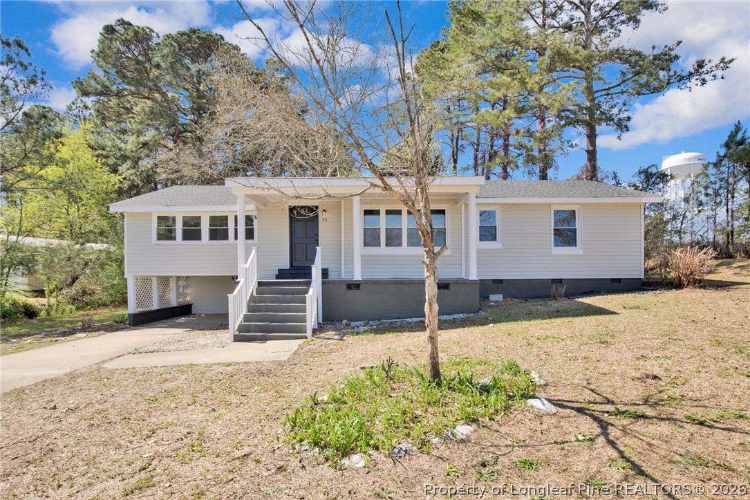 88 Hannah Creek Road Four Oaks, NC 27524 - Photo 2 of 31 a front view of a house with a yard covered in snow