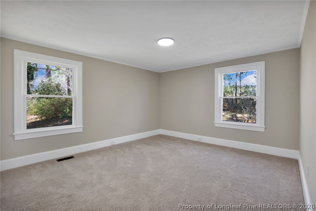 88 Hannah Creek Road Four Oaks, NC 27524 - Photo 22 of 31 an empty room with windows