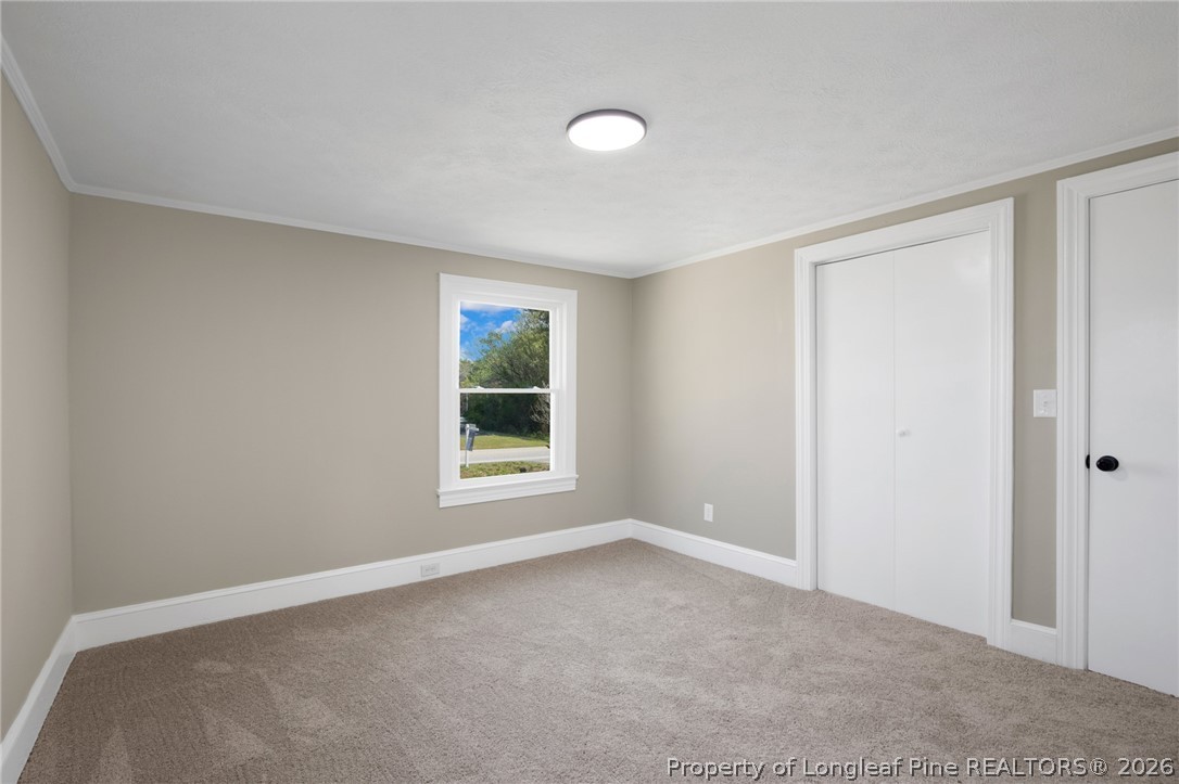 88 Hannah Creek Road Four Oaks, NC 27524 - Photo 25 of 31 an empty room with windows and closet