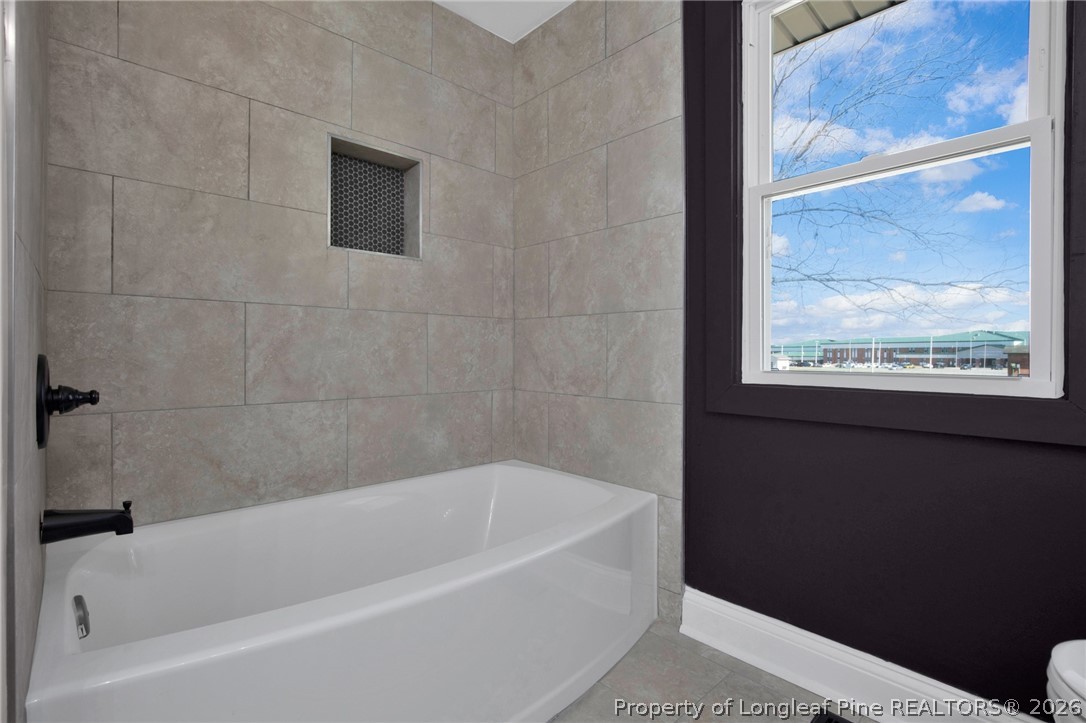 88 Hannah Creek Road Four Oaks, NC 27524 - Photo 27 of 31 a bathroom with a bathtub