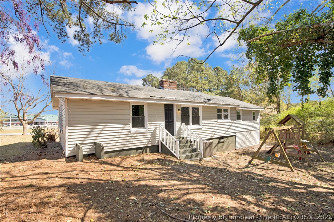 88 Hannah Creek Road Four Oaks, NC 27524 - Photo 28 of 31 a front view of a house with a yard and potted plants