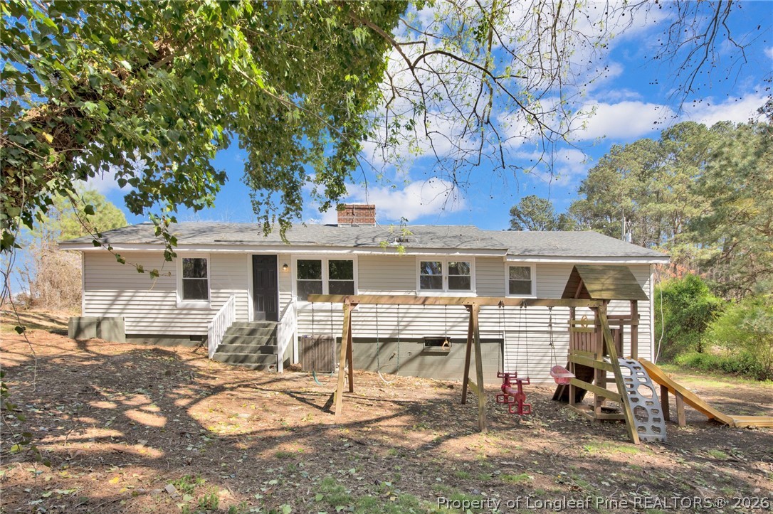 88 Hannah Creek Road Four Oaks, NC 27524 - Photo 29 of 31 a view of a yard with a house and sitting area