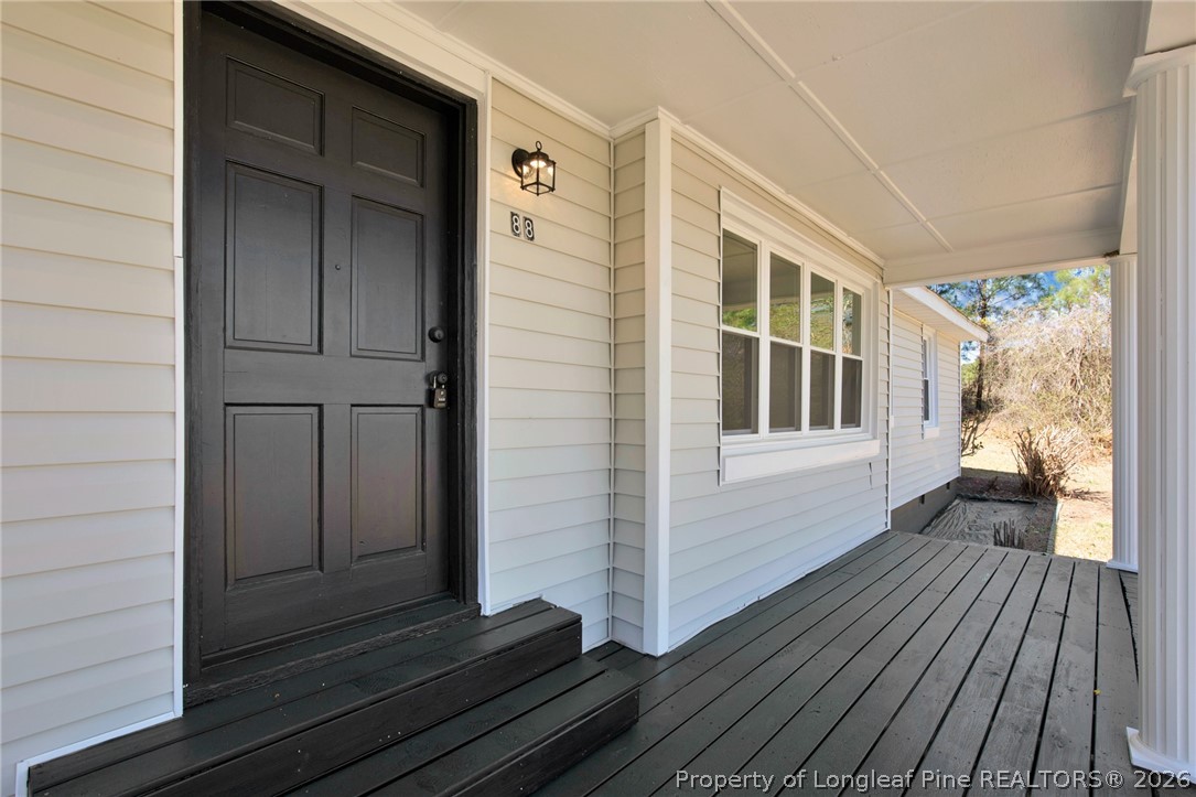 88 Hannah Creek Road Four Oaks, NC 27524 - Photo 3 of 31 a view of front door deck and living room