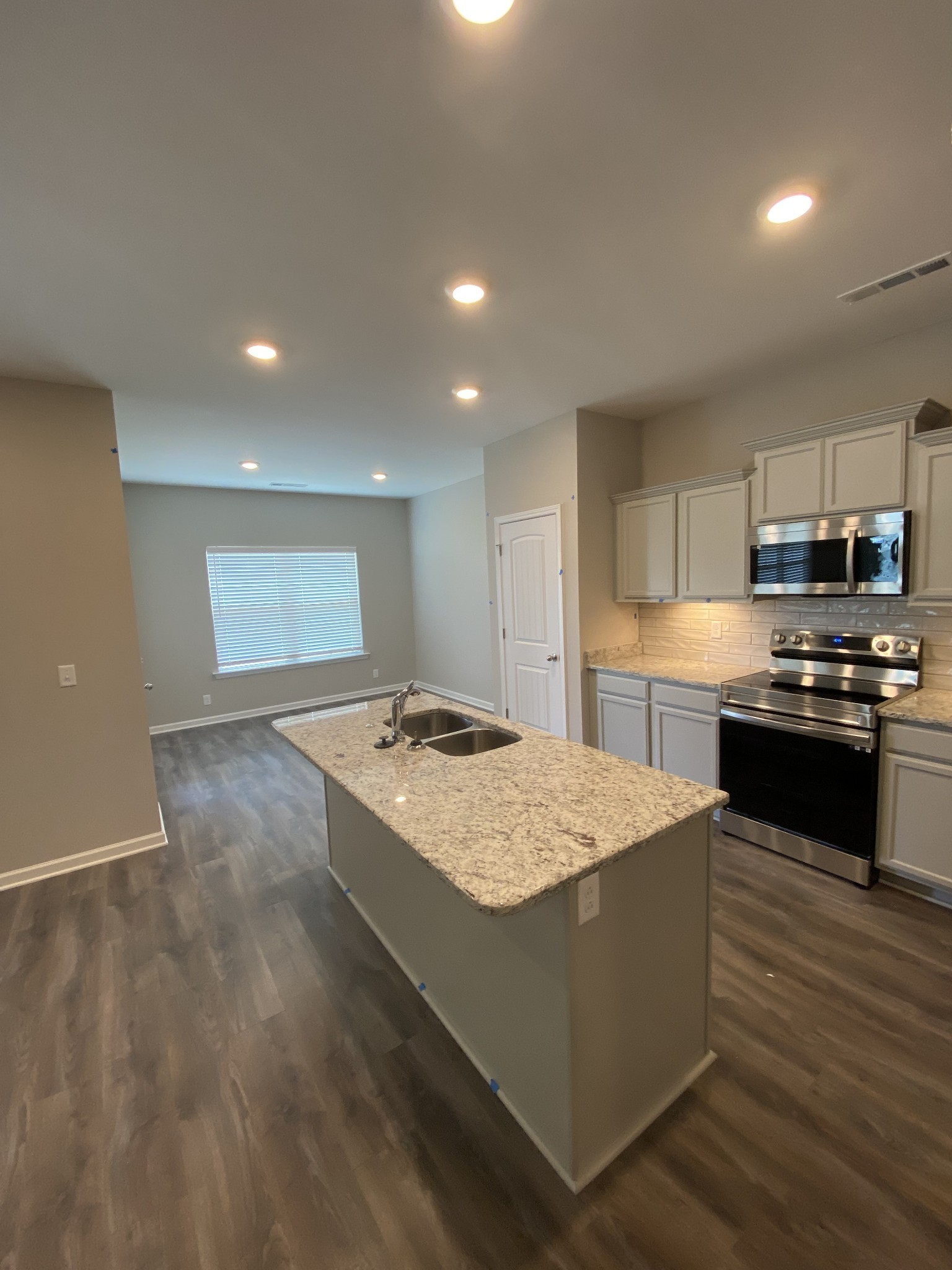 4118 Bungee Way Murfreesboro, TN 37128 - Photo 2 of 9 a kitchen with granite countertop a stove and a sink
