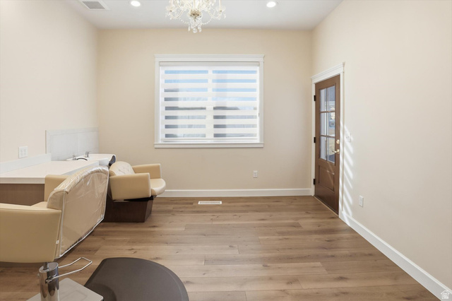 534 East Fish Hatchery Road Mantua, UT 84324 - Photo 40 of 87 Sitting room featuring hanging lights and light wood-style flooring