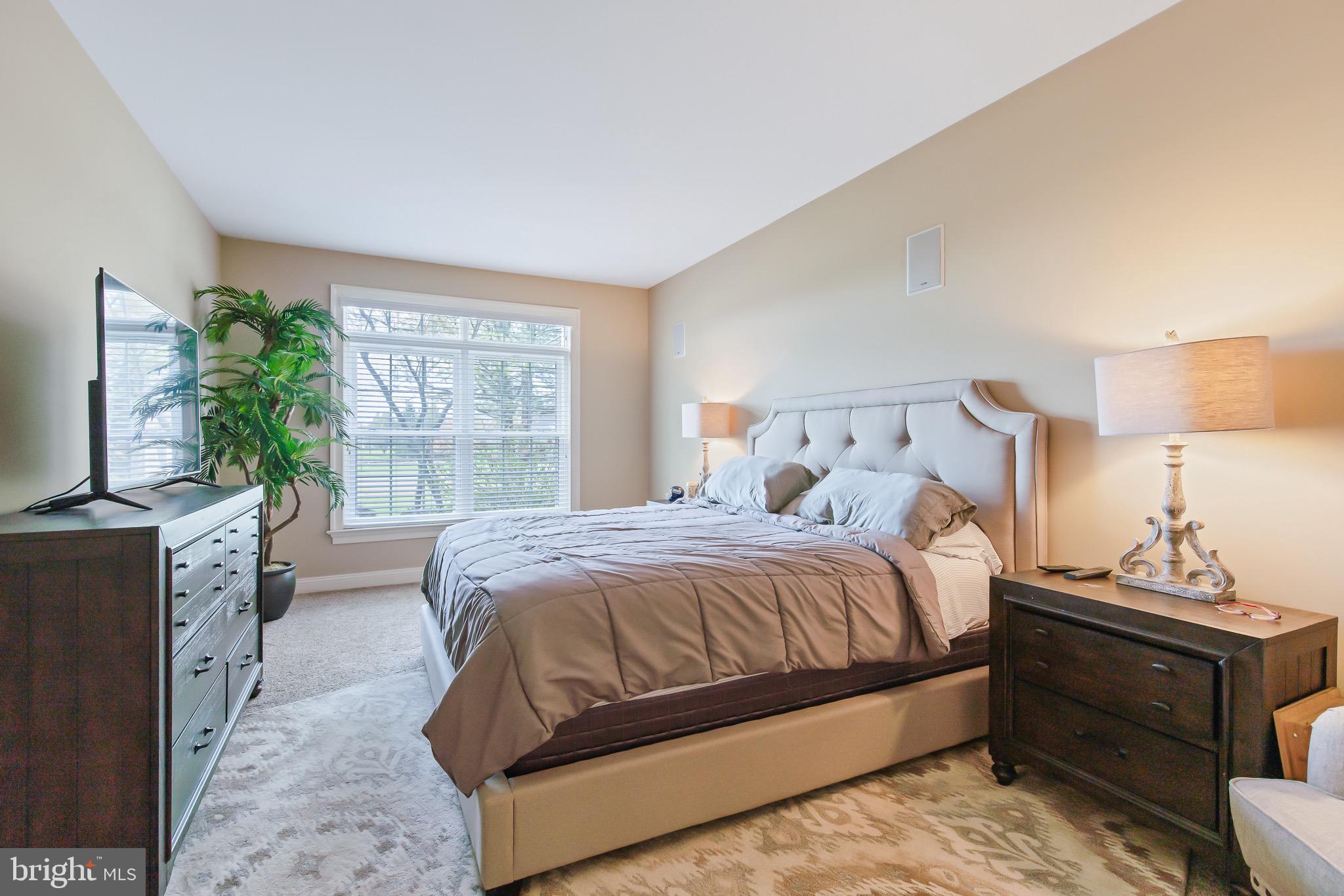 616 Northfield Road Lititz, PA 17543 - Photo 12 of 30 a bedroom with a bed and a flat screen tv