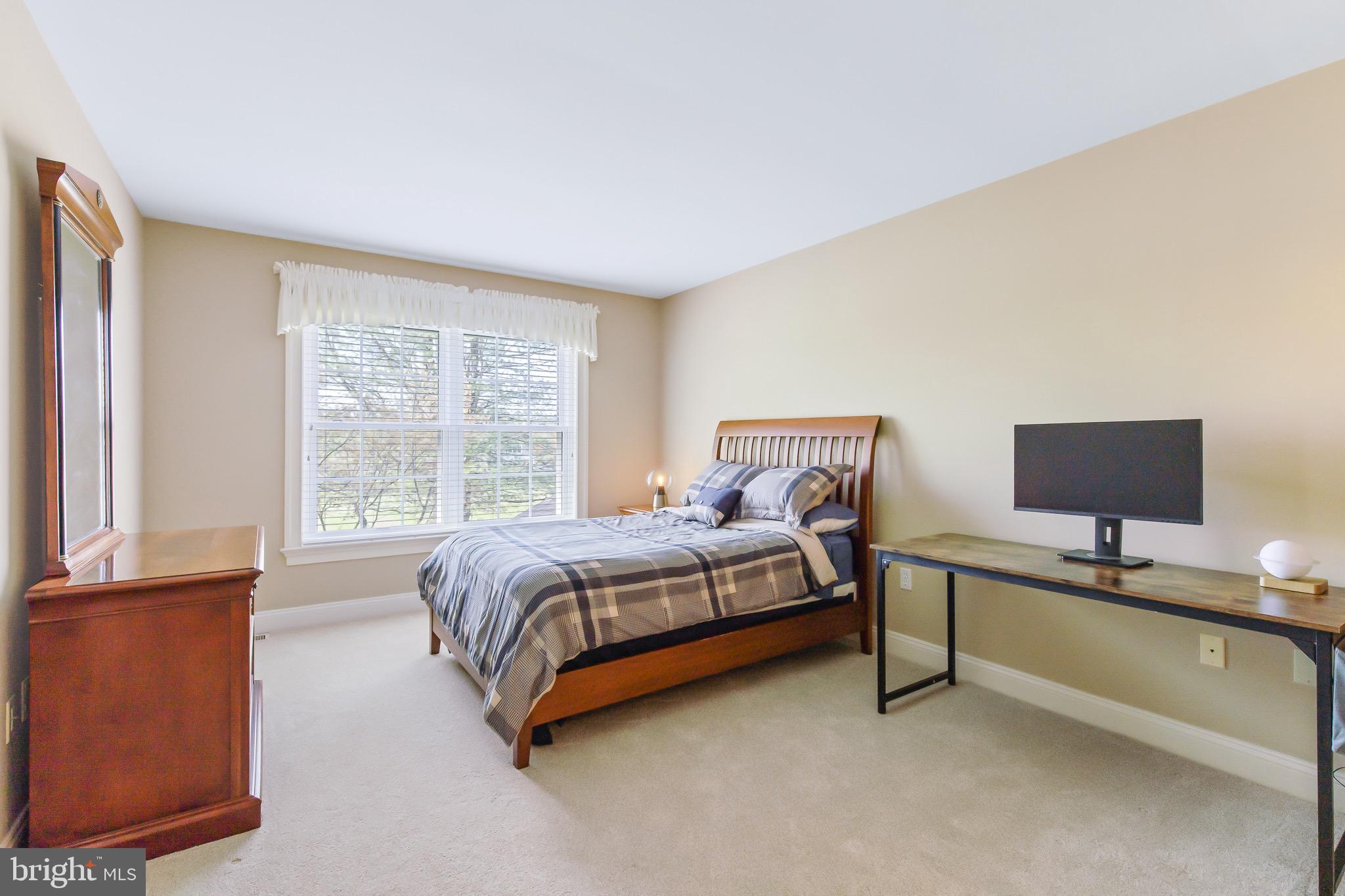 616 Northfield Road Lititz, PA 17543 - Photo 17 of 30 a bedroom with a bed and a couch