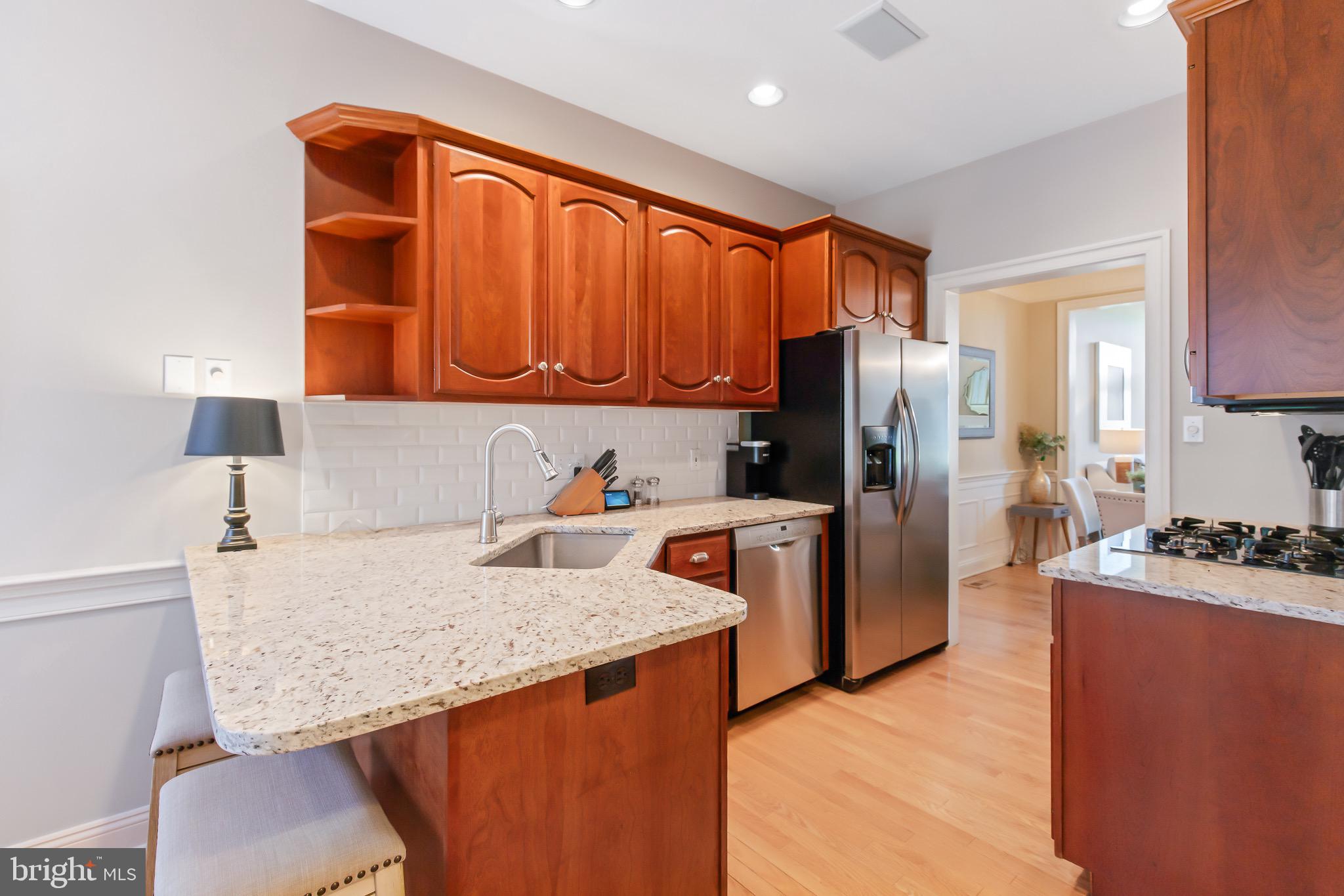 616 Northfield Road Lititz, PA 17543 - Photo 5 of 30 a kitchen with stainless steel appliances granite countertop a refrigerator a stove and a sink