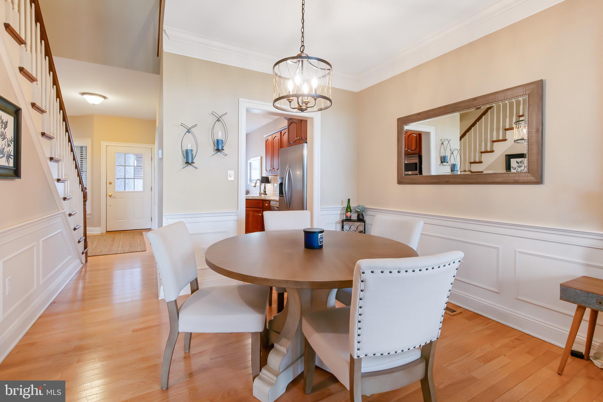 616 Northfield Road Lititz, PA 17543 - Photo 8 of 30 a view of a dining room with furniture wooden floor and a chandelier