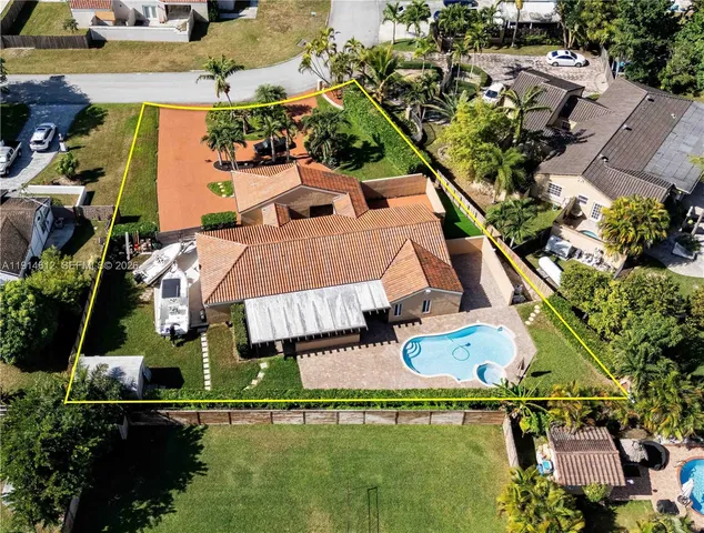 an aerial view of house with a yard