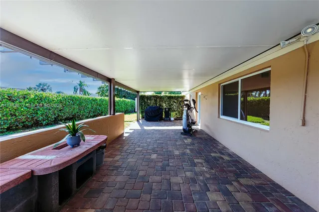 a view of a swimming pool with a yard