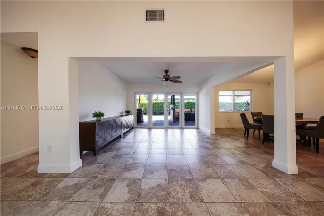 a lobby with furniture and floor to ceiling window