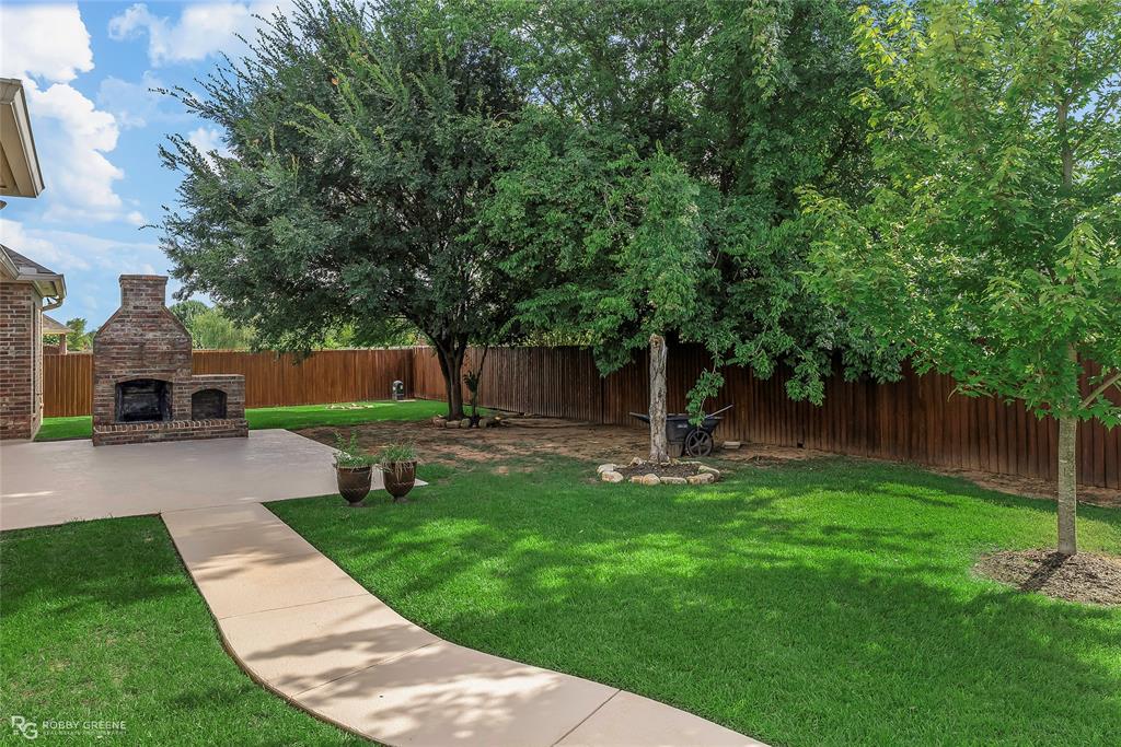 4743 Old Brownlee Road Bossier City, LA 71111 - Photo 13 of 40 a front view of a house with garden