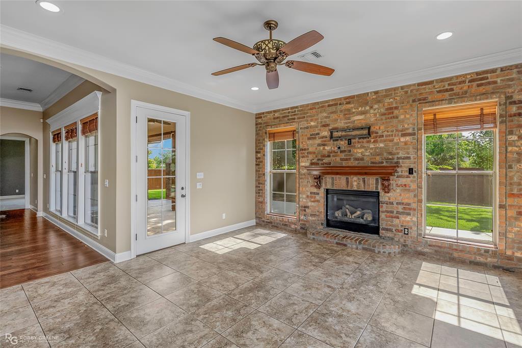 4743 Old Brownlee Road Bossier City, LA 71111 - Photo 22 of 40 a view of an empty room with a fireplace and a window