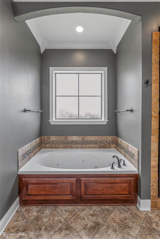 4743 Old Brownlee Road Bossier City, LA 71111 - Photo 28 of 40 a bathroom with a bathtub and window
