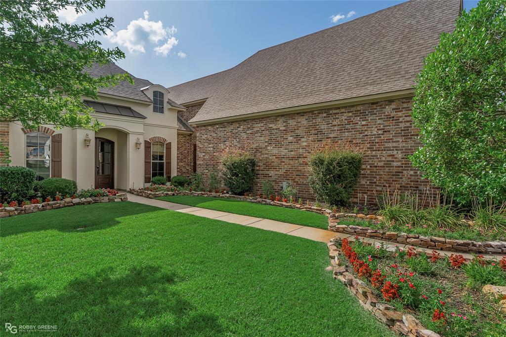 4743 Old Brownlee Road Bossier City, LA 71111 - Photo 3 of 40 a view of a house with a big yard and potted plants