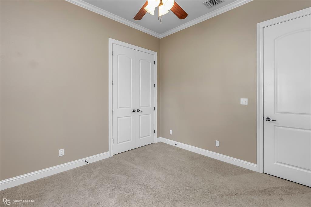 4743 Old Brownlee Road Bossier City, LA 71111 - Photo 32 of 40 an empty room with a chandelier fan