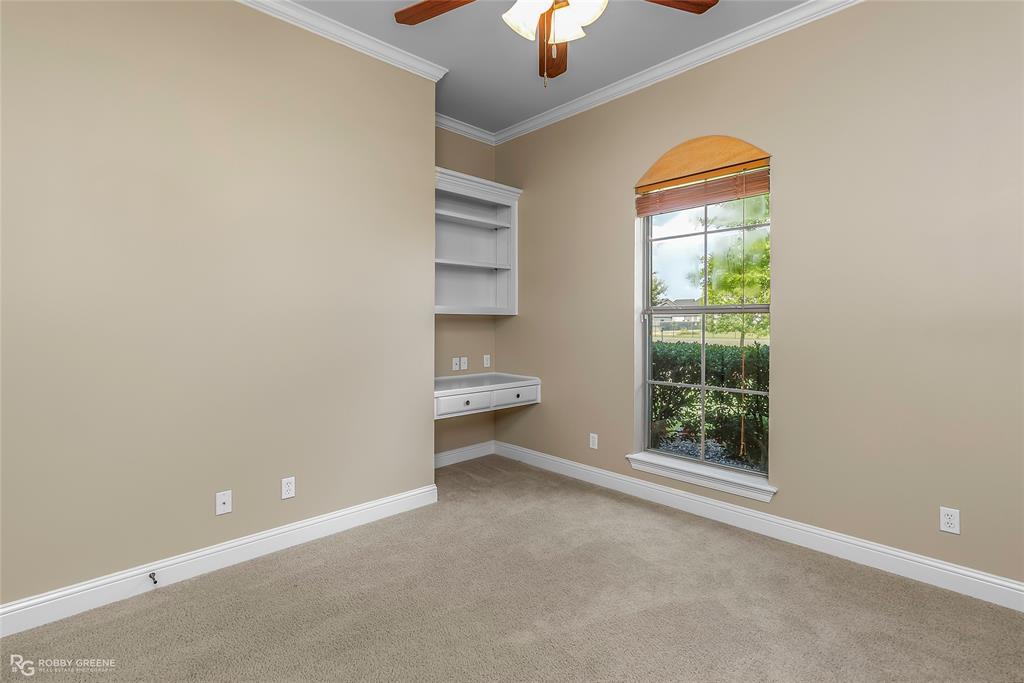 4743 Old Brownlee Road Bossier City, LA 71111 - Photo 34 of 40 an empty room with a window and a chandelier fan