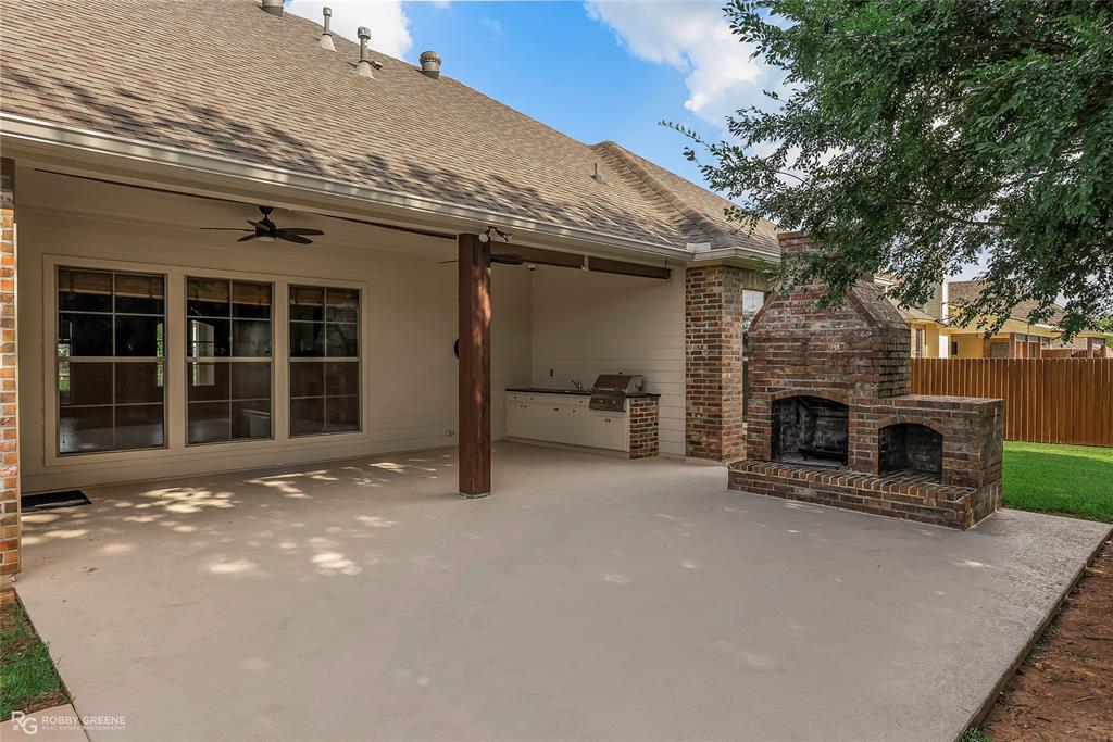 4743 Old Brownlee Road Bossier City, LA 71111 - Photo 6 of 40 a view of a fireplace and chair in the room