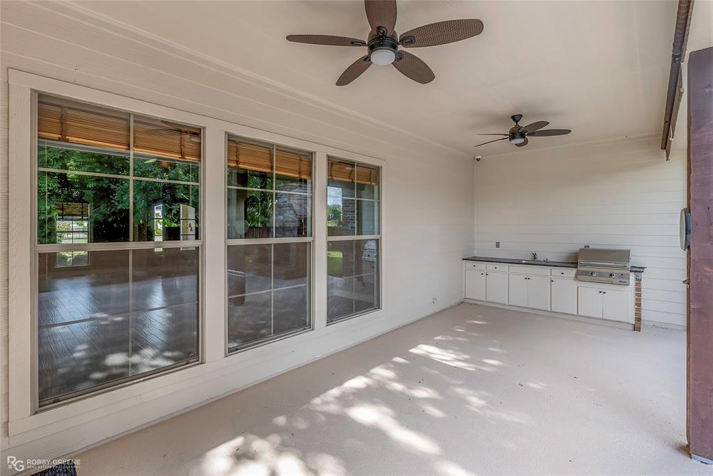 4743 Old Brownlee Road Bossier City, LA 71111 - Photo 7 of 40 a view of a livingroom with a ceiling fan and window