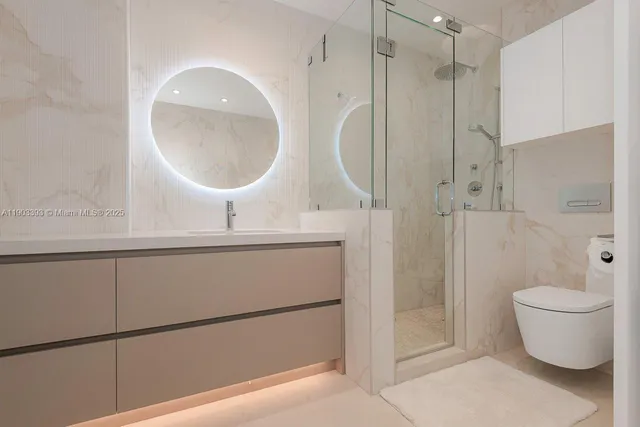 a bathroom with a toilet a sink and a mirror