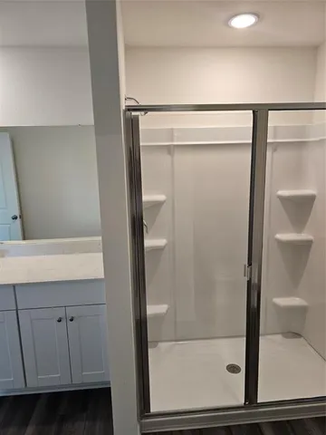 an empty room with windows and closet