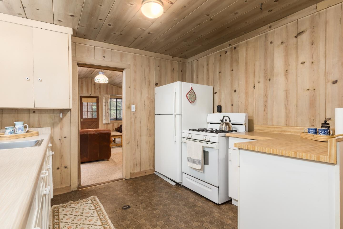155 Brier Drive Boulder Creek, CA 95006 - Photo 12 of 42 a kitchen with a stove a refrigerator and a sink