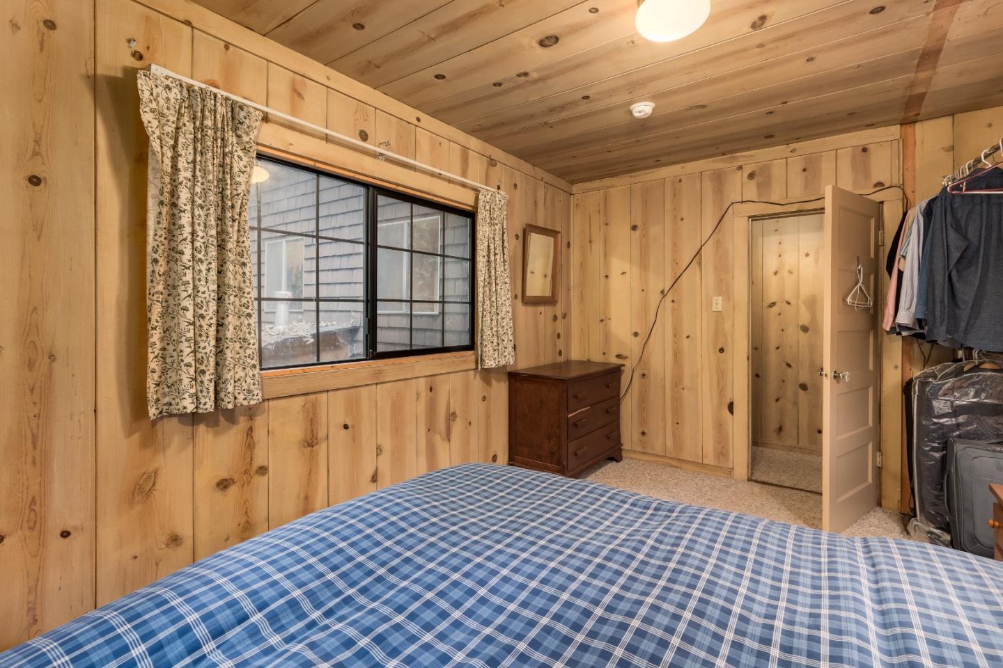 155 Brier Drive Boulder Creek, CA 95006 - Photo 14 of 42 a bedroom with a bed and a window