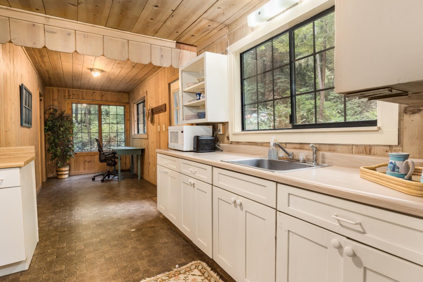 155 Brier Drive Boulder Creek, CA 95006 - Photo 17 of 42 a bathroom with a sink and a large window