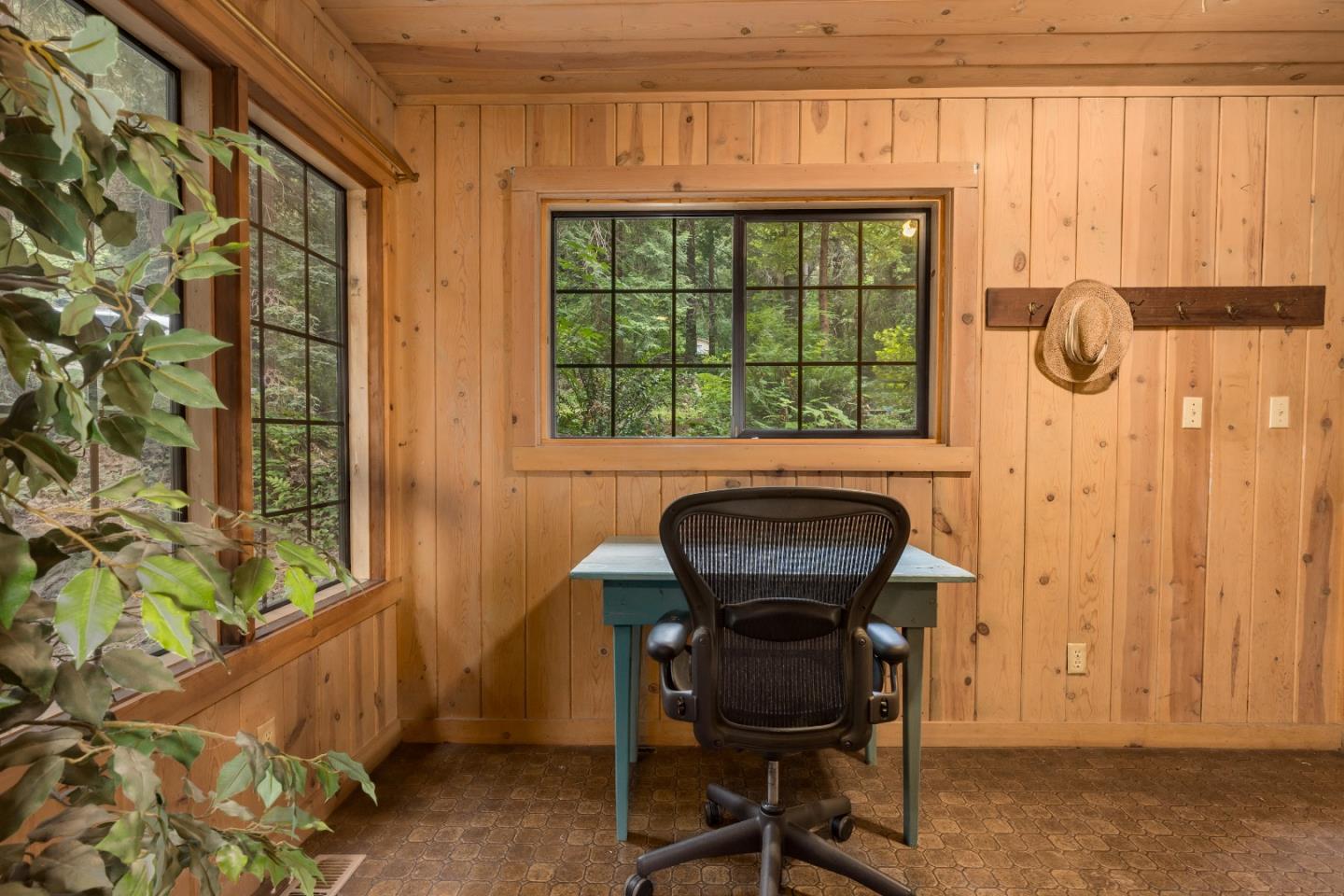 155 Brier Drive Boulder Creek, CA 95006 - Photo 19 of 42 a view of a room with a window and chair