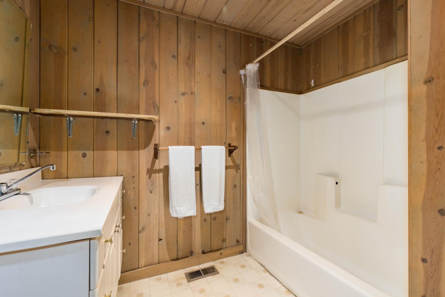 155 Brier Drive Boulder Creek, CA 95006 - Photo 33 of 42 a bathroom with a tub sink and a mirror