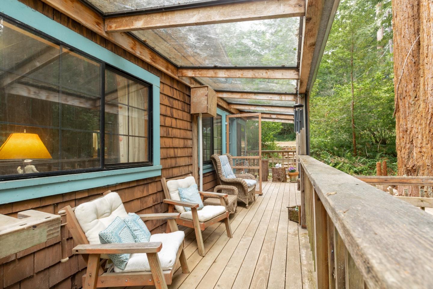 155 Brier Drive Boulder Creek, CA 95006 - Photo 6 of 42 a balcony with furniture and a potted plant