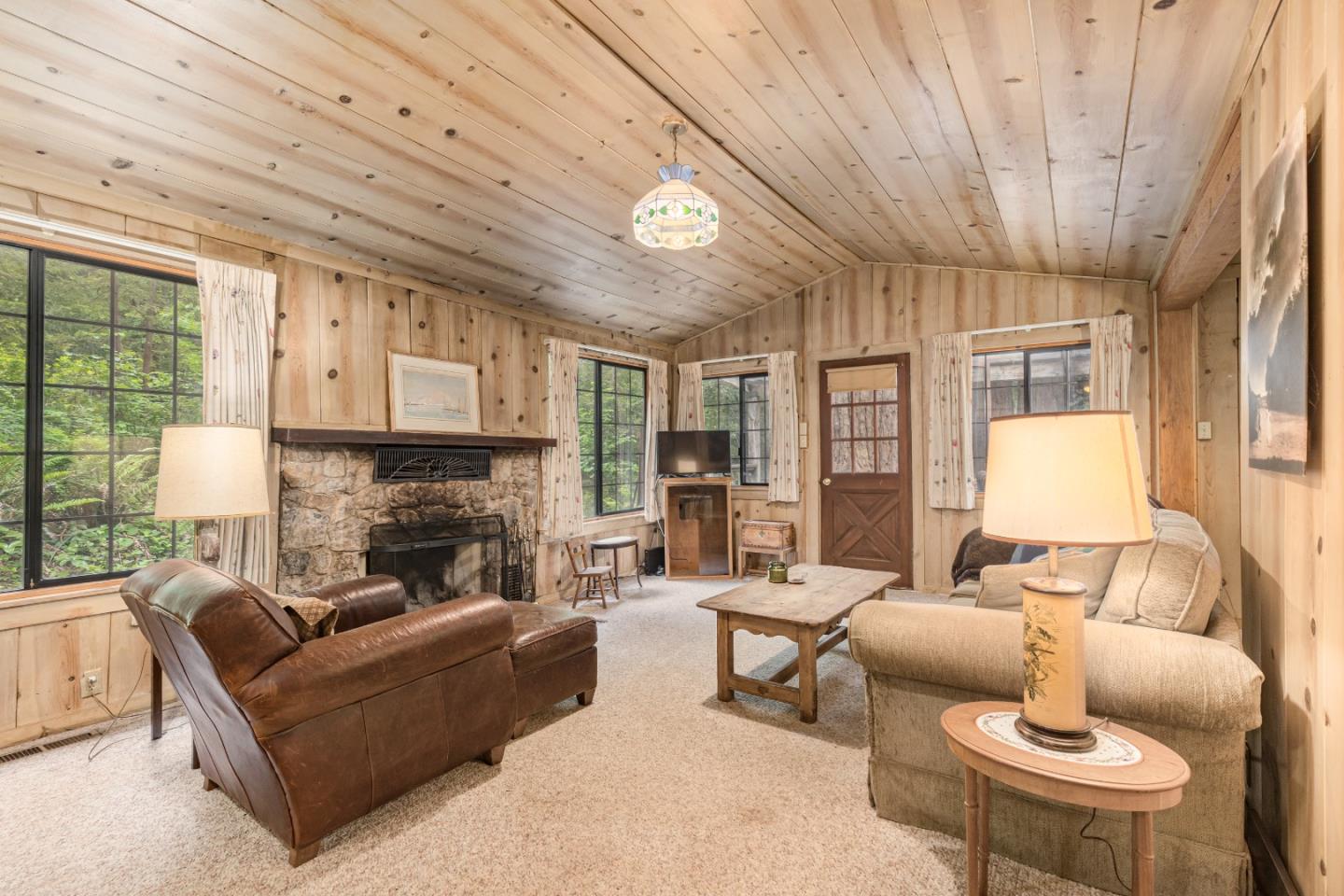 155 Brier Drive Boulder Creek, CA 95006 - Photo 7 of 42 a living room with furniture and a fireplace