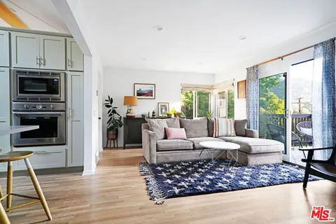 a living room with furniture or outdoor view and a large window